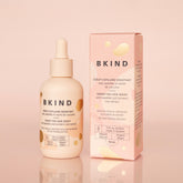 BKIND hair serum bottle and packaging on a pink background