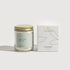 Candle with gold lid and Oli & Eve box on a white background